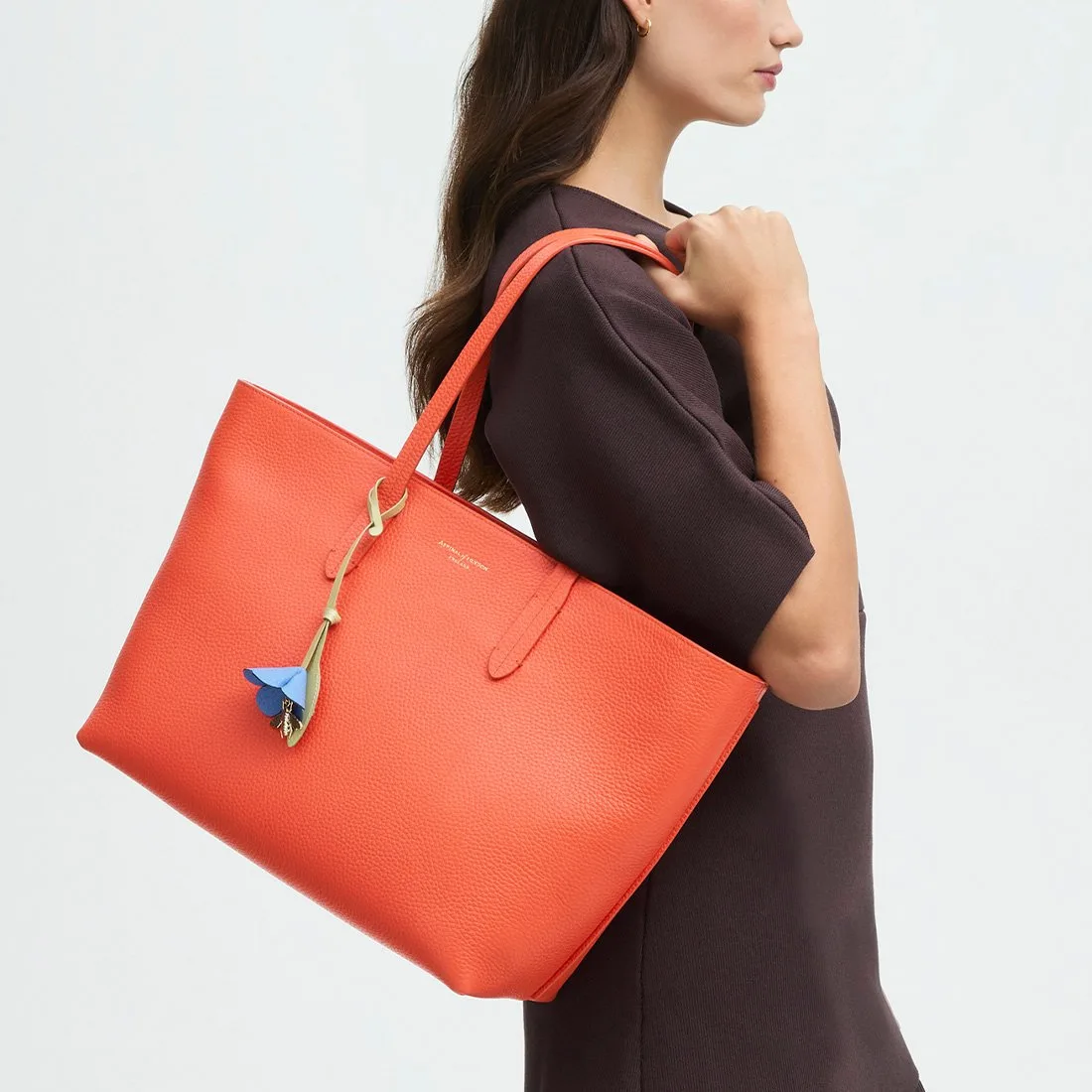 Aspinal of London Zipped East West Coral Pebble Leather Tote Bag with Charm