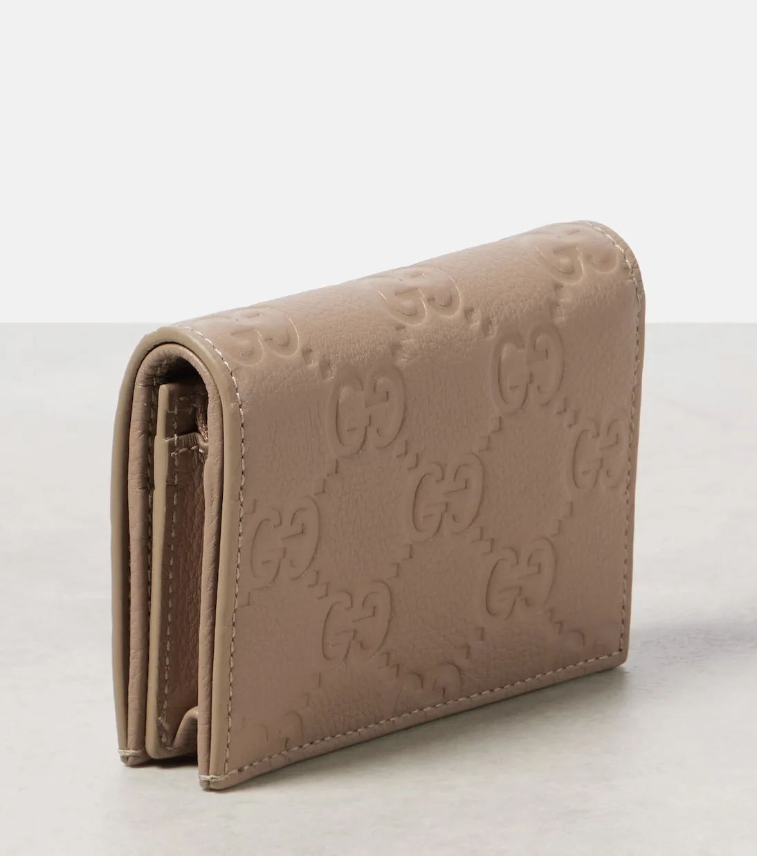 Gucci GG Mini Debossed Beige Leather Wallet